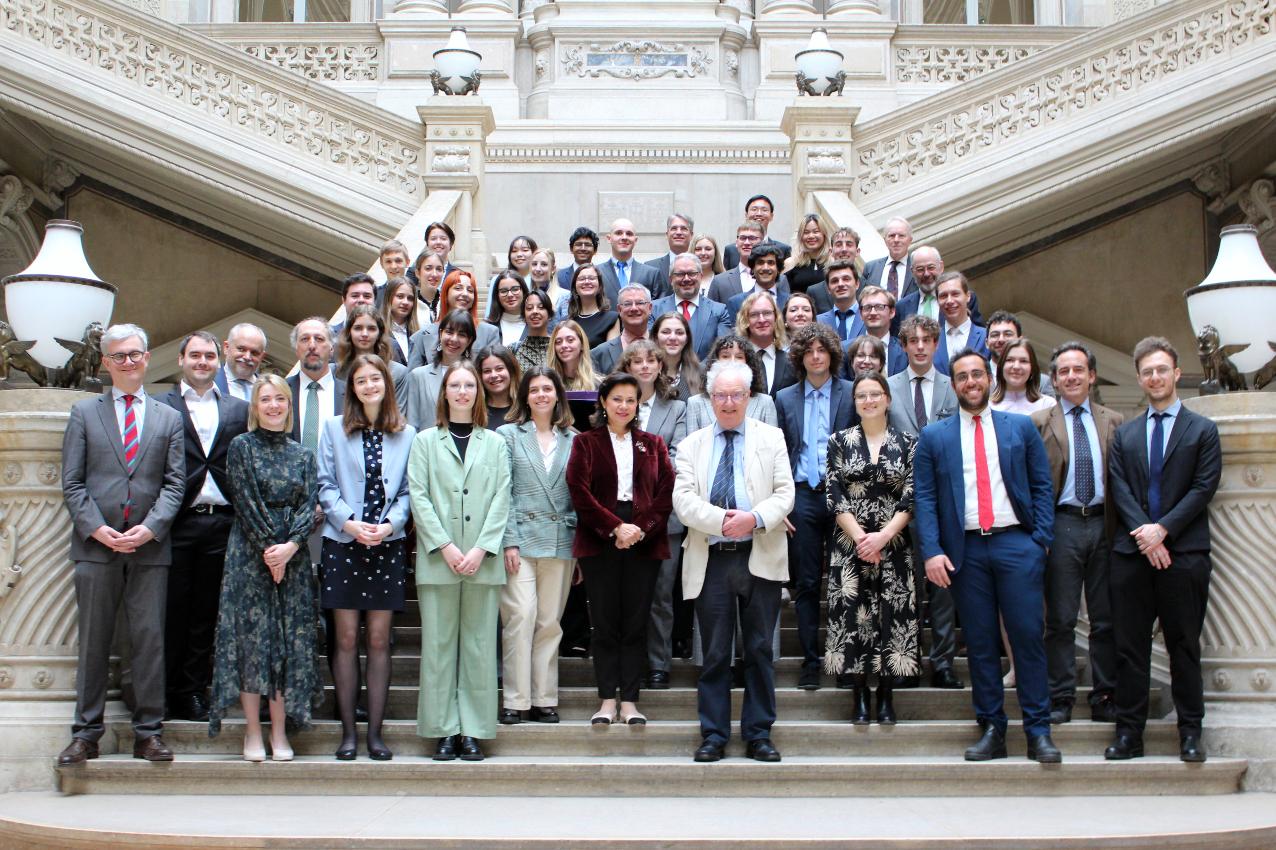 Group photograph of Moot participants on the grand staircase of the Justizpalast in Vienna